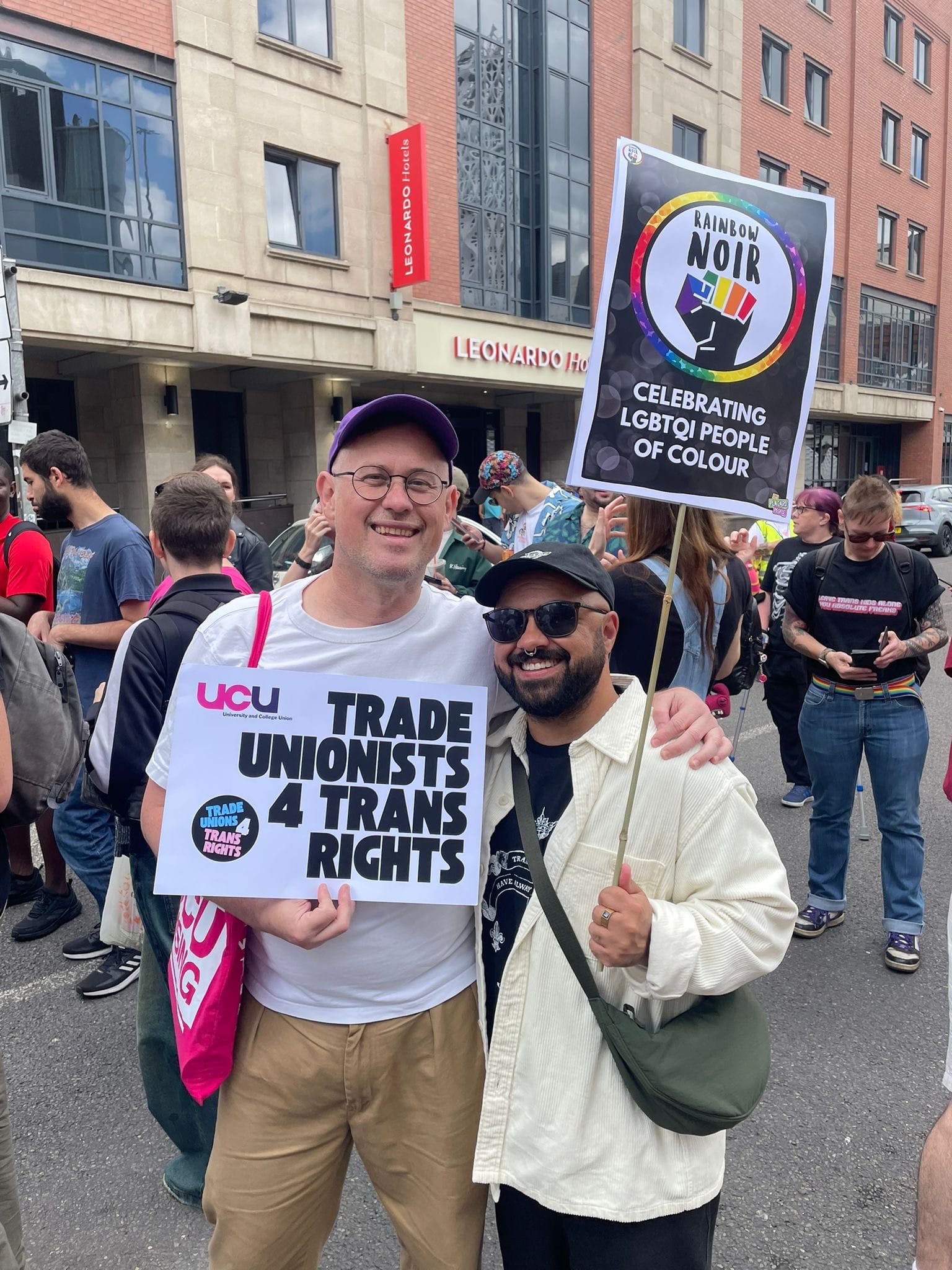 Mark holding a trans rights placard