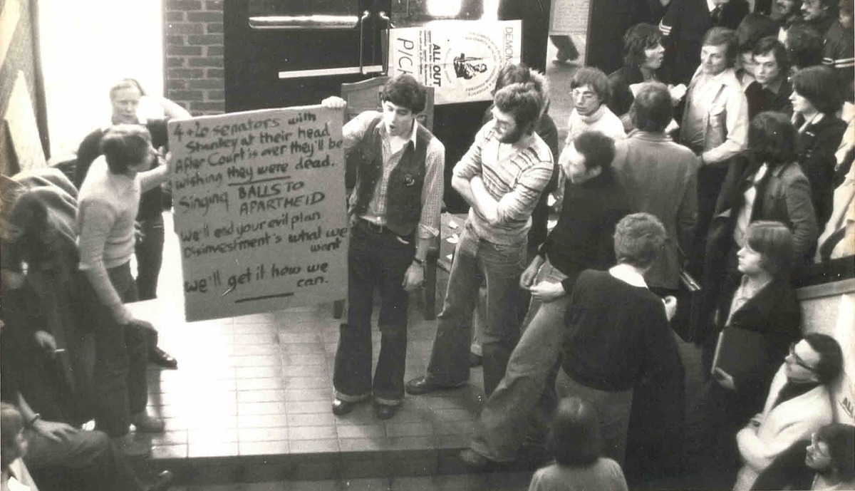 This image shows a demonstration against South African apartheid at Hull University Students' Union in 1978. In the photo are