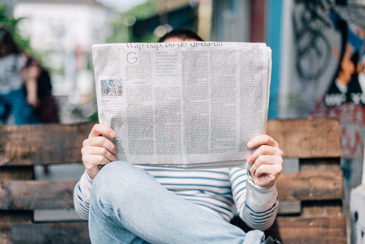 A stock image of a man reading a newspaper